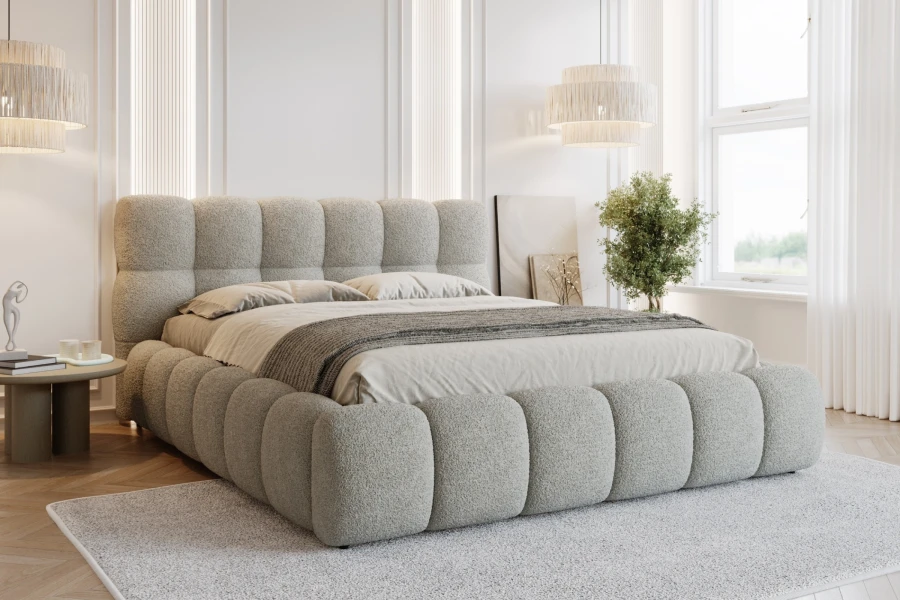 Helles graues Polsterbett im Bubble-Look für ein stilvolles Schlafzimmer.