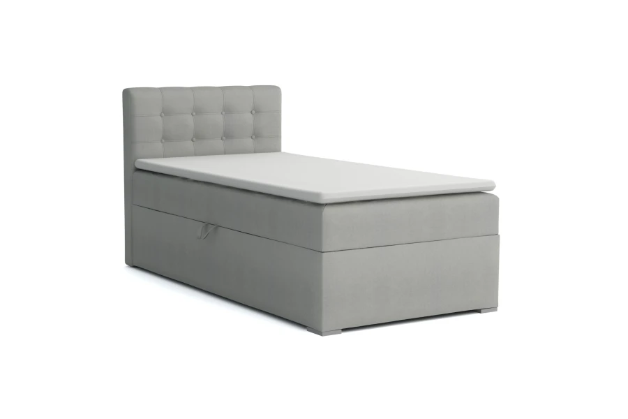 Modernes graues Boxspringbett Einzelbett mit Bettkasten und weißem Topper auf weißem Hintergrund.