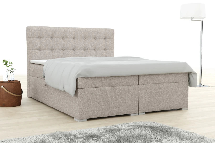 Modernes Boxspringbett Claudia in Beige mit gestepptem Kopfteil in gemütlichem Schlafzimmer.