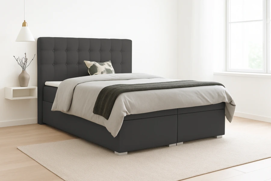 Elegantes Boxspringbett Claudia in dunklem Grau mit gestepptem Kopfteil im modernen Schlafzimmer.