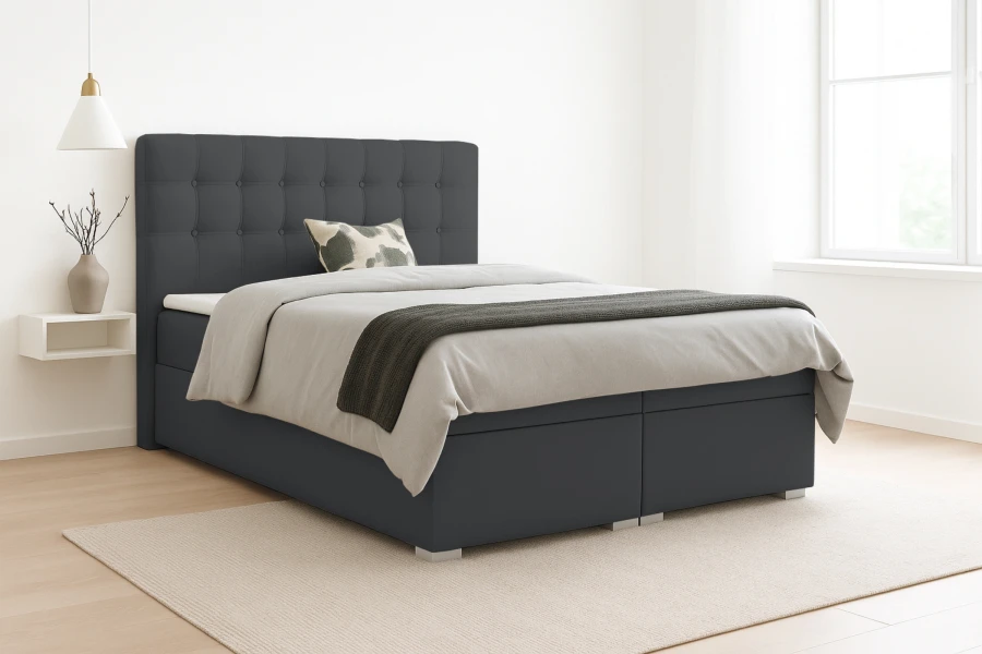 Modernes Boxspringbett in Dunkelgrau mit gepolstertem Kopfteil für ein stilvolles Schlafzimmer.