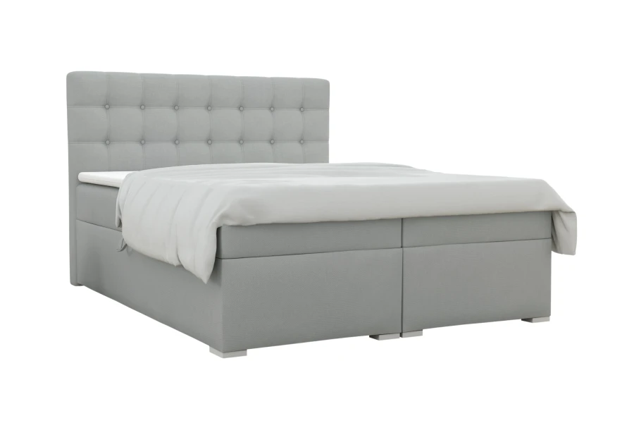Freigestellte Ansicht eines modernen Boxspringbetts in Grau mit dekorativem, gepolstertem Kopfteil.