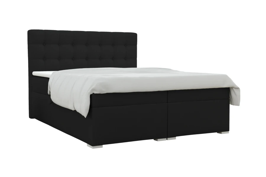 Schwarzes Boxspringbett mit gestepptem Kopfteil vor weißem Hintergrund