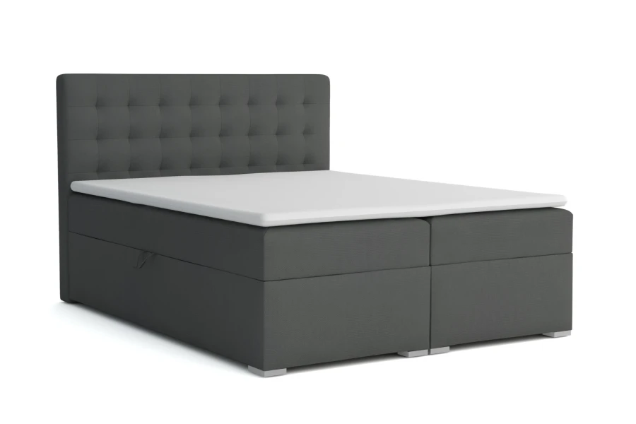 Elegantes anthrazitfarbenes Boxspringbett mit gestepptem Kopfteil auf weißem Hintergrund.