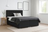 Schwarzes Boxspringbett Livia stilvoll eingerichtet in einem modernen Schlafzimmer.