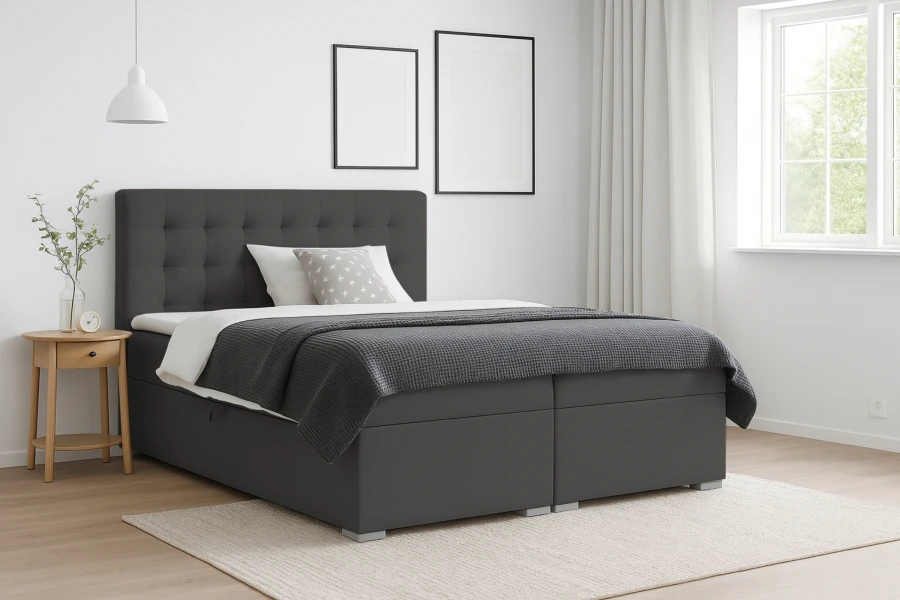 Modernes Boxspringbett in Anthrazit mit gestepptem Kopfteil und Bettkasten im Schlafzimmer.