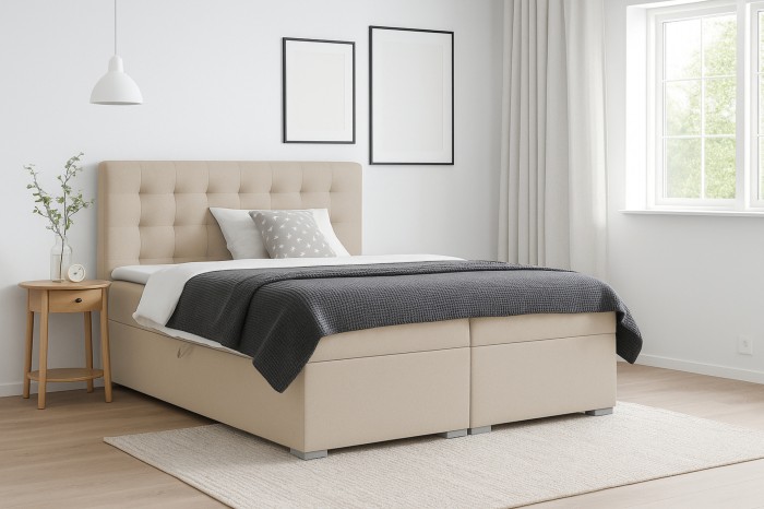 Beige boxspringbed in een modern ingerichte slaapkamer.