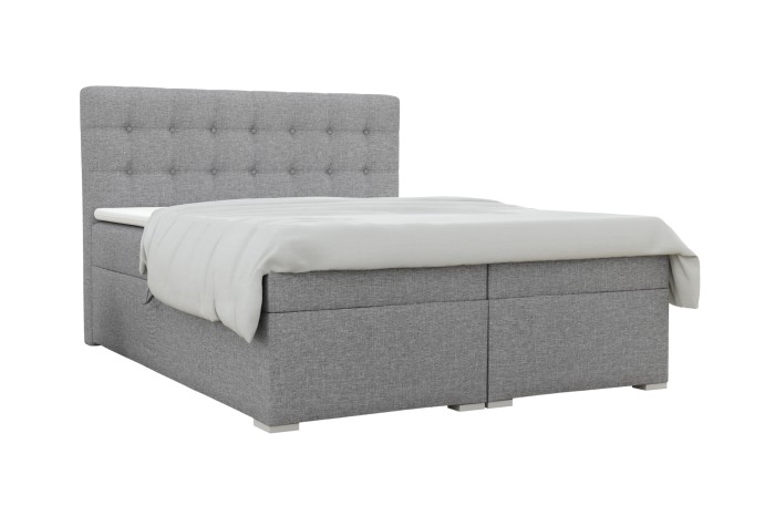 Modernes Boxspringbett in Grau mit gestepptem Kopfteil und weißer Auflage.