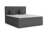 Modernes graues Boxspringbett mit Bettkasten und Kissen vor weißem Hintergrund.