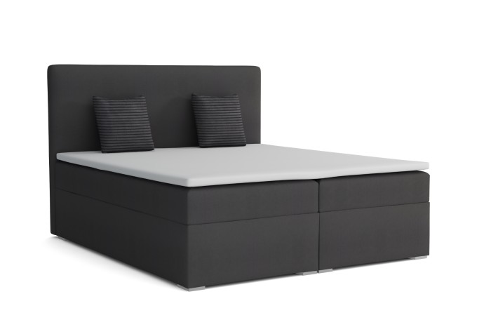 Anthrazitfarbenes Boxspringbett mit weißem Topper und Kissen auf weißem Grund.