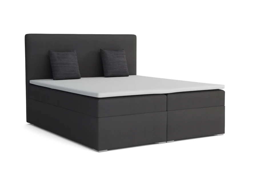 Elegantes Boxspringbett in Anthrazit mit gepolstertem Kopfteil und weißer Matratze.