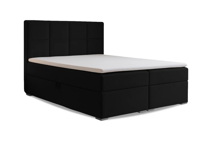 Schwarzes Boxspringbett Caro mit gestepptem Kopfteil freigestellt vor weißem Hintergrund.