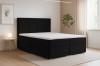 Modernes Boxspringbett in Schwarz mit hohem Kopfteil im Schlafzimmer.