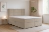 Modernes Boxspringbett in Beige in einem hell eingerichteten Schlafzimmer