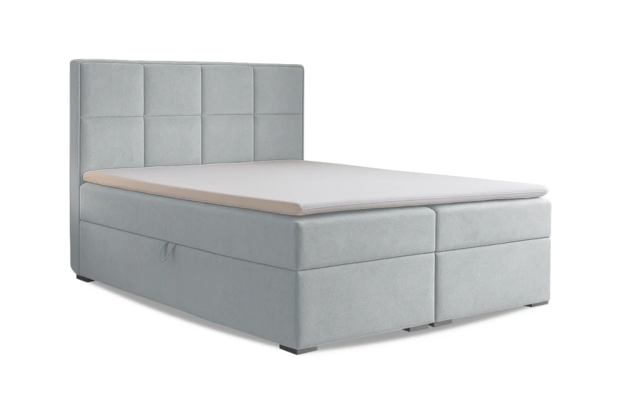 Hellblaues Boxspringbett mit integriertem Stauraum und weißem Topper