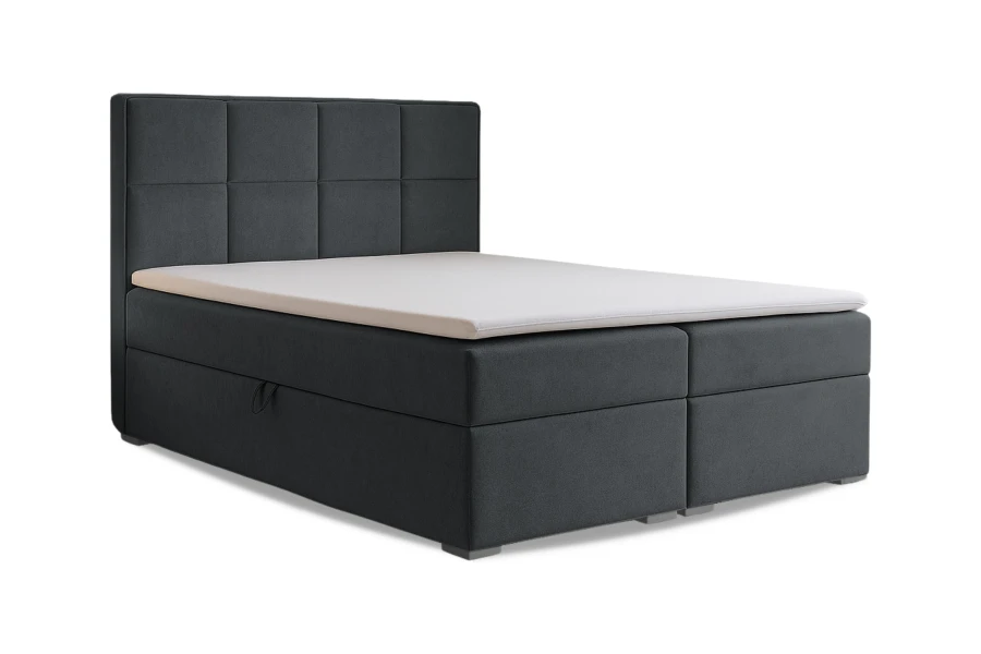 Dunkelgraues Boxspringbett mit Stauraum und gestepptem Kopfteil.