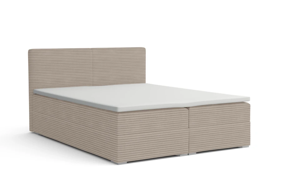 Beige Boxspringbett mit Cord-Bezug auf weißem Hintergrund, freigestellt.