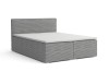 Graues Boxspringbett mit strukturiertem Cordbezug vor weißem Hintergrund.