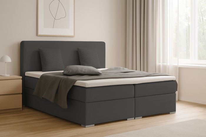Moderne slaapkamerambiance met het donkergrijze boxspringbed Bello en nachtkastje.