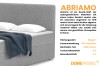 Detailweergave van de grijze Abriamo bouclé-stof met technische gegevens over de materiaaleigenschappen.