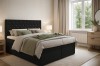Schwarzes Boxspringbett Arami im gemütlichen Schlafzimmer mit modernen Möbeln.