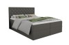 Dunkelgraues Boxspringbett mit gestepptem Kopfteil und Glitzersteinen vor weißem Hintergrund.