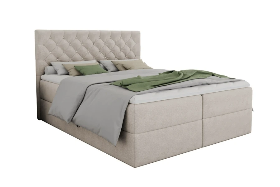 Elegantes beiges Boxspringbett mit Knopfheftung am Kopfteil und grauer Bettwäsche.
