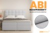 ABI boxspringbed in lichtblauw met stofdetail en focus op stijl en comfort.