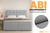 Promofoto ABI boxspringbed met detailweergave van de hoogwaardige, lichtblauwe textielstructuur.
