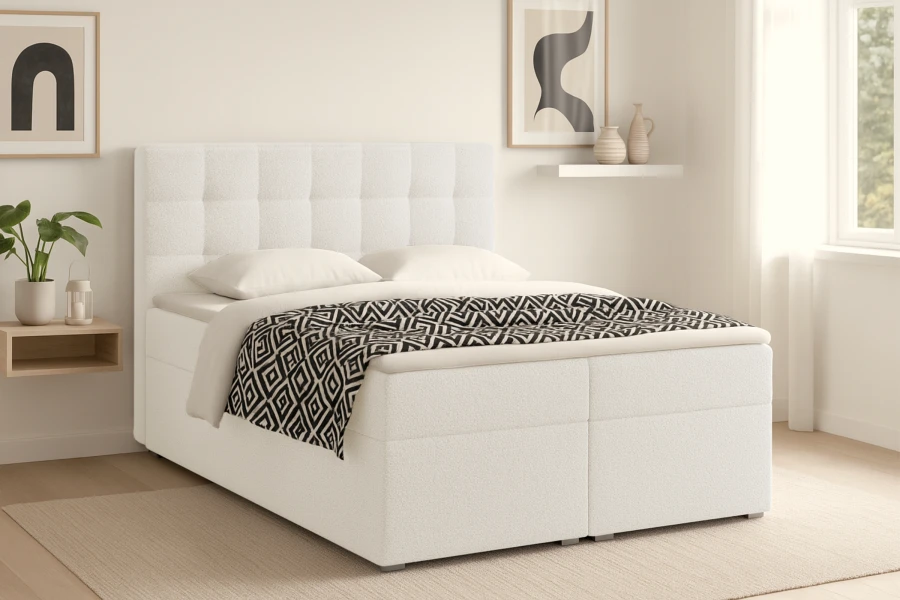 Modernes weißes Boxspringbett mit weichem Polster-Kopfteil und Bettwäsche
