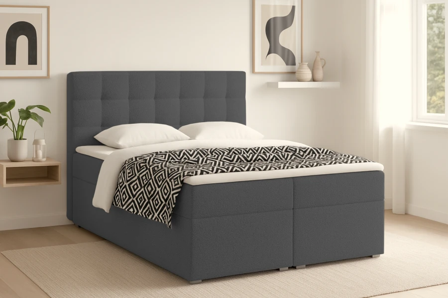 Anthrazitfarbenes Boxspringbett mit Rautensteppung am Kopfteil in modernem Schlafzimmer-Design.