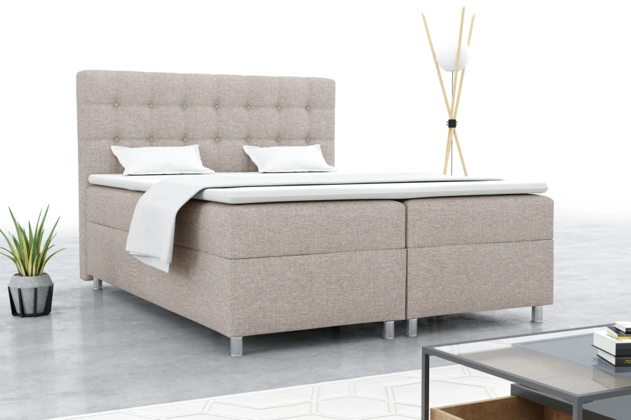 Beiges Brill Boxspringbett in einer modernen Raumsituation mit minimalistischer Dekoration.
