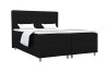 Elegantes Boxspringbett in Schwarz mit gepolstertem Kopfteil und weißer Bettwäsche.