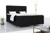 Modernes Boxspringbett in Schwarz mit gepolstertem Kopfteil für ein stilvolles Schlafzimmer.