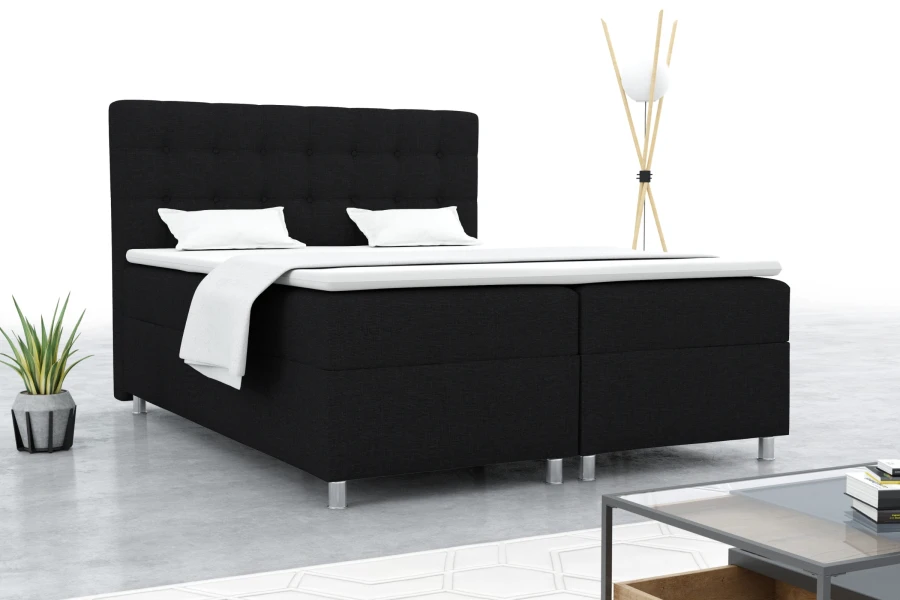 Modernes Boxspringbett in Schwarz mit gepolstertem Kopfteil für ein stilvolles Schlafzimmer.