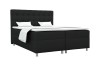 Schwarzes Boxspringbett auf weißem Hintergrund mit silbernen Füßen und weißem Topper.