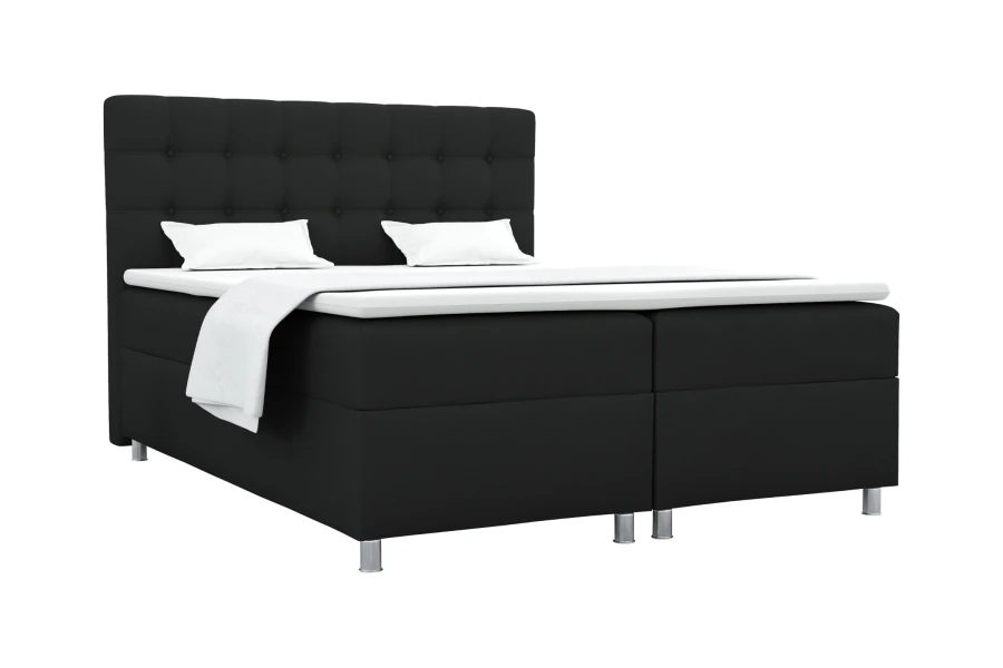 Schwarzes Boxspringbett auf weißem Hintergrund mit silbernen Füßen und weißem Topper.