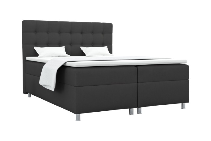 Anthrazitfarbenes Boxspringbett mit gestepptem Kopfteil und Topper vor weißem Hintergrund.