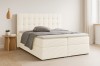 Elegantes Boxspringbett in Beige mit hochwertigem Cord-Bezug und weichem Topper.