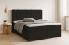 Modernes anthrazitfarbenes Boxspringbett mit gestepptem Kopfteil in einem hellen Schlafzimmer.