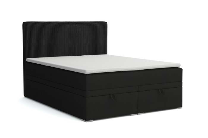Modern zwart boxspringbed met geribbeld hoofdbord en twee geïntegreerde opbergruimtes.
