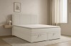 Modernes beige Boxspringbett Daga in einem hellen, gemütlich eingerichteten Schlafzimmer.
