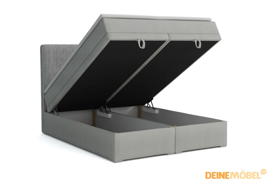 Boxspringbett in Grau mit zwei weit geöffneten Bettkästen für viel Stauraum im Schlafzimmer.