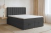 Graues Boxspringbett mit Stauraum und gestepptem Kopfteil im Schlafzimmer.