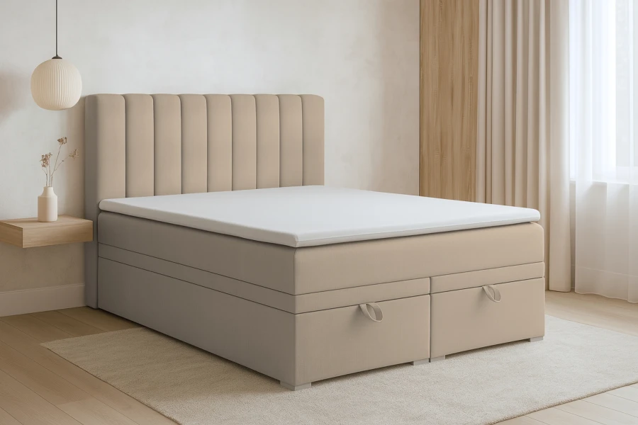 Beiges Boxspringbett mit gestepptem Kopfteil und zwei integrierten Bettkästen im modernen Schlafzimmer.