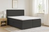 Dunkelgraues Boxspringbett Dream im gemütlich eingerichteten Schlafzimmer.