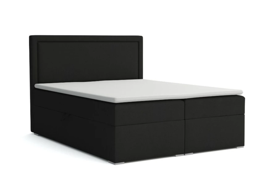 Schwarzes Boxspringbett mit weißem Topper und praktischem Bettkasten.