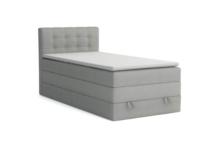 Graues Polster-Boxspringbett JUNG I mit modernem Steppmuster am Kopfteil.