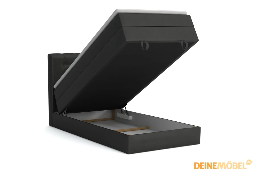 Dunkelgraues Polsterbett mit aufgeklapptem Bettkasten für Stauraum.
