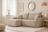 Beiges Ecksofa in hellem Wohnzimmer mit skandinavischem Design und rundem Spiegel.